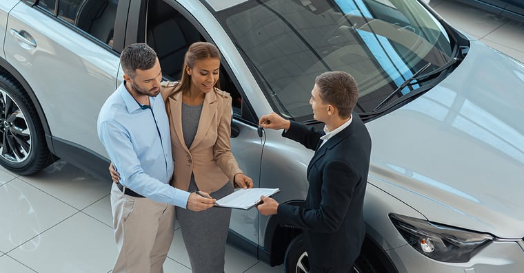 image-of-a-car-salesman-talking-with-prospective-buyers