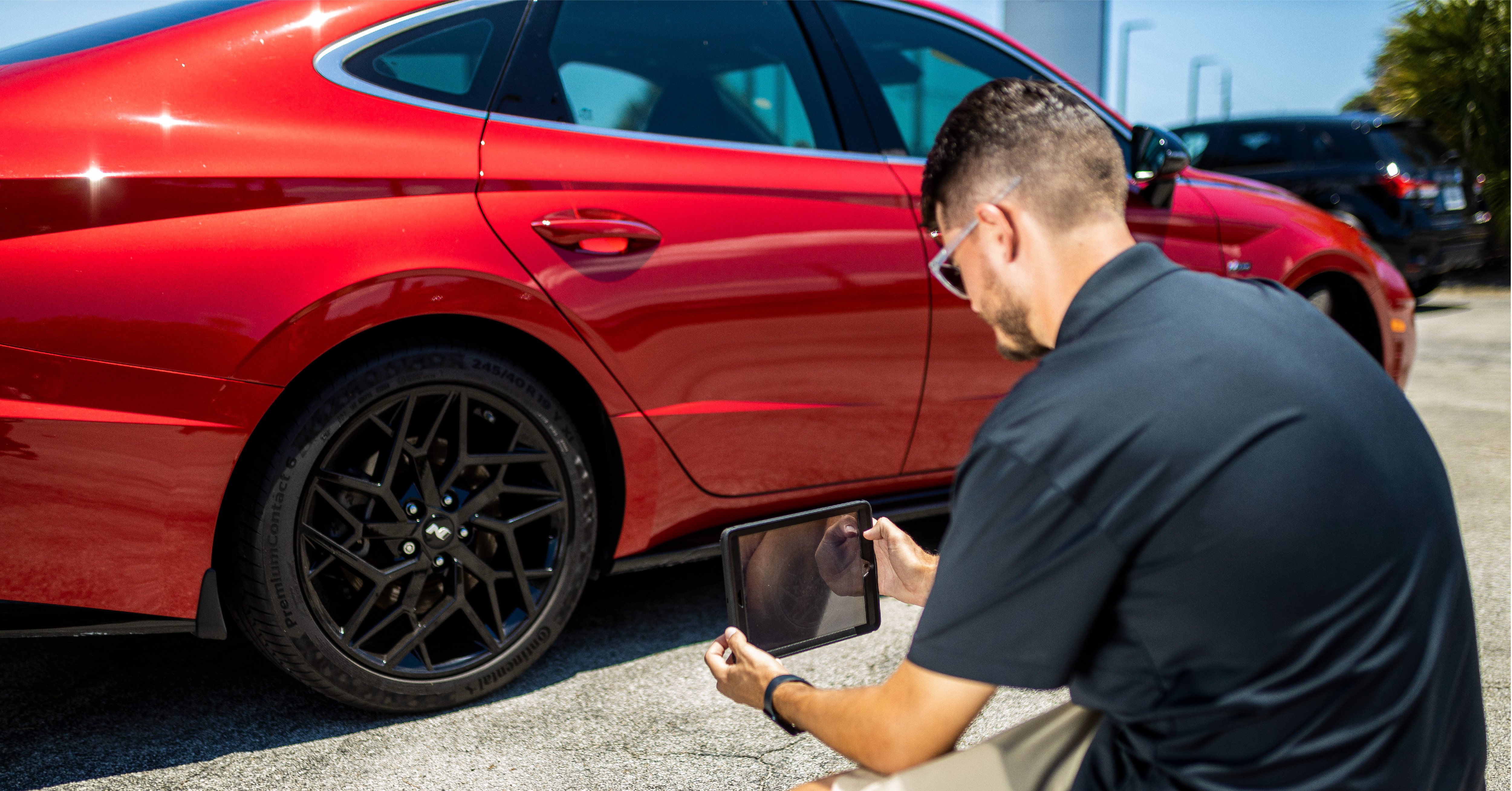 professional-car-photographer-shooting-a-vehicle