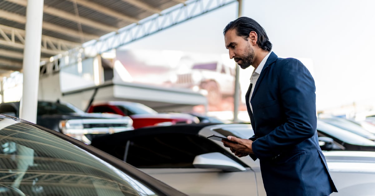 car-salesman-considering-options-to-sell-vehicles