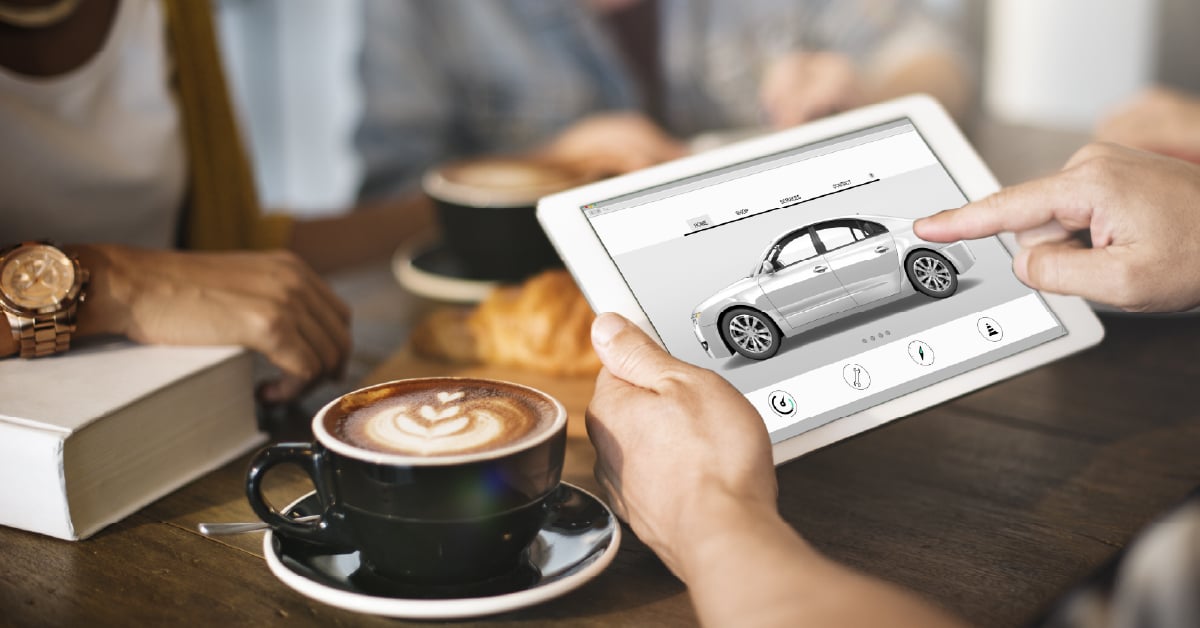 Customer shopping for cars online using a tablet to view photos