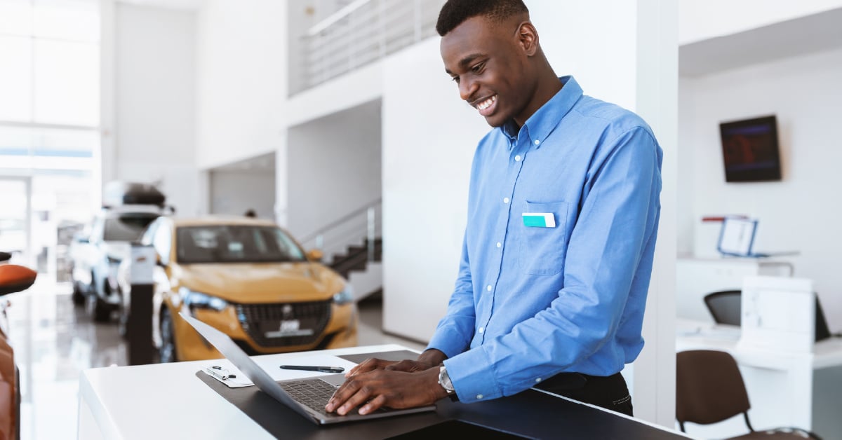 salesman-looking-at-car-numbers