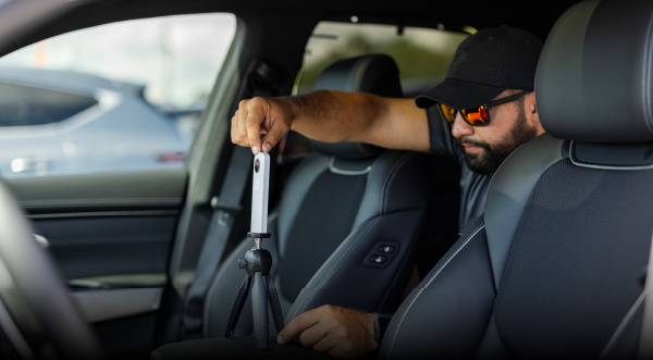 Professional car photographer shooting the interior of a vehicle